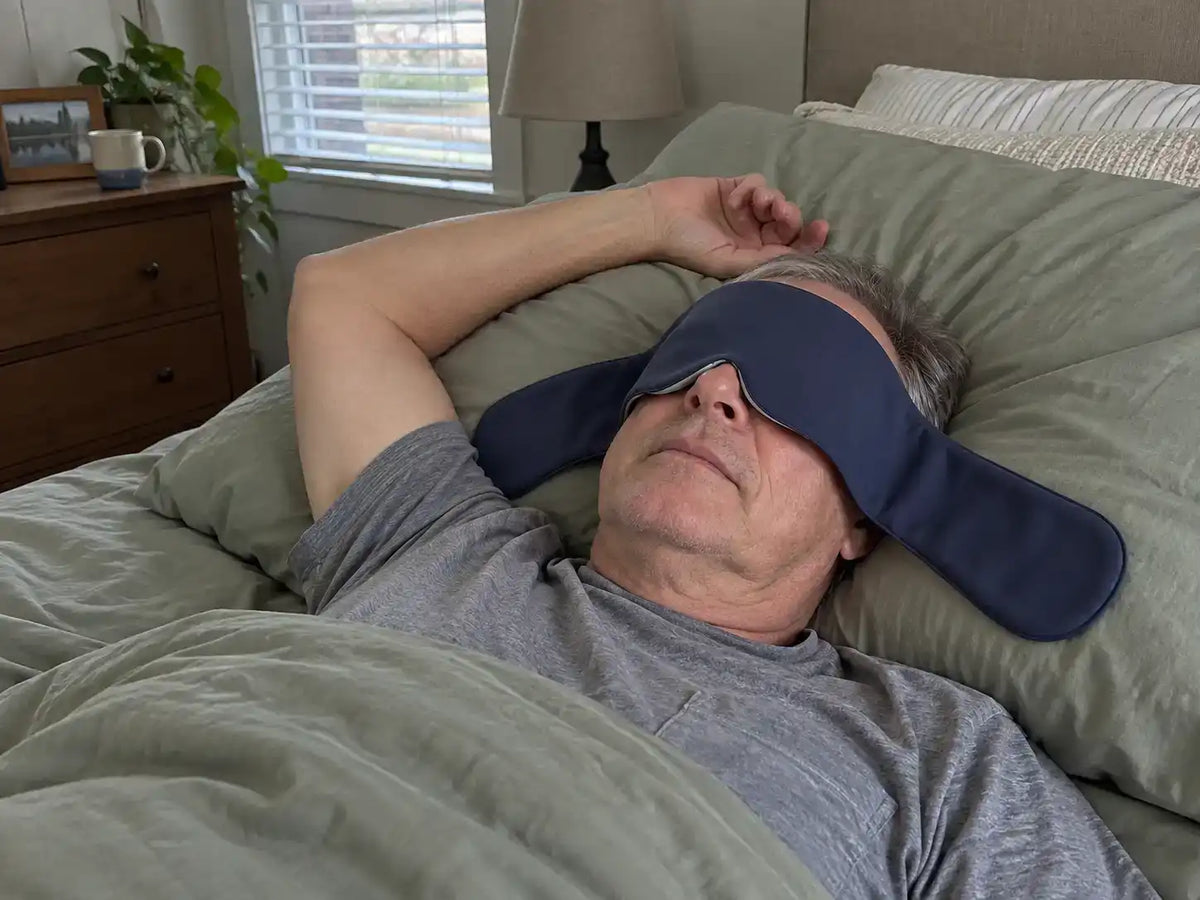 Customer wearing a CalmHug sleep mask