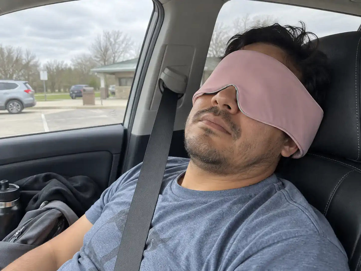 Customer wearing a CalmHug sleep mask