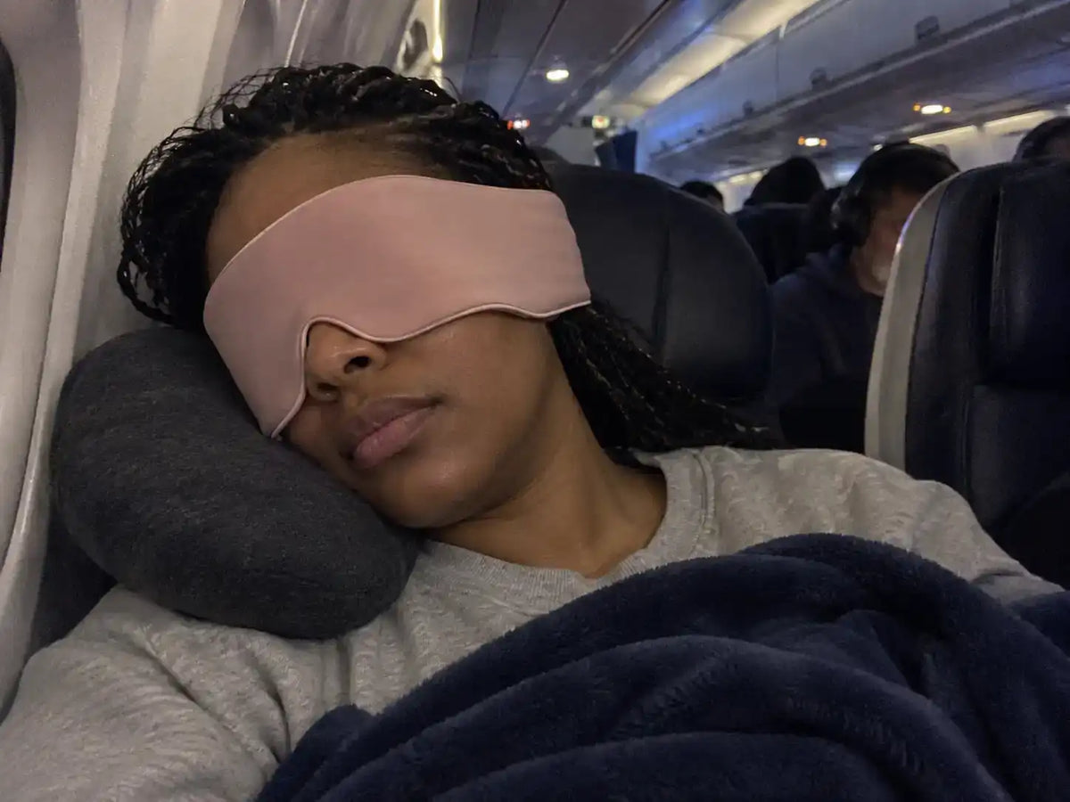 Customer wearing a CalmHug sleep mask