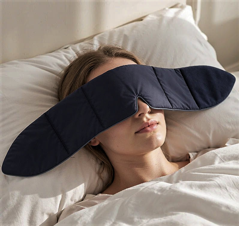 Customer wearing a CalmHug sleep mask